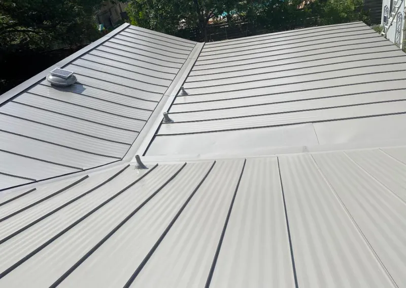 Solar attic fan installed on a metal roof for Roof Ventilation in Mount Healthy